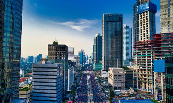 pexels-photo-2116721-2116721 Stunning aerial view of Jakarta's modern skyline with bustling streets below.